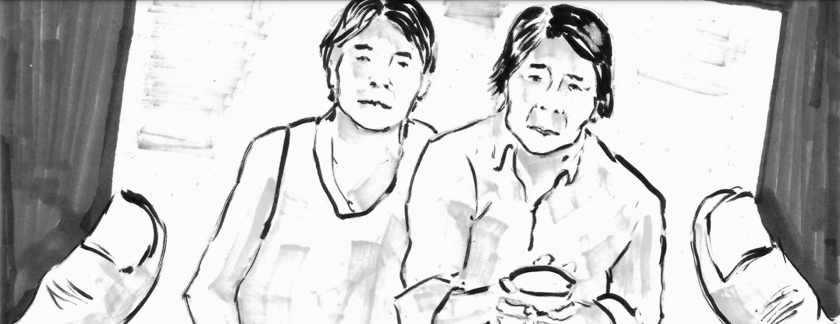 View of a raised photograph, showing two individuals.