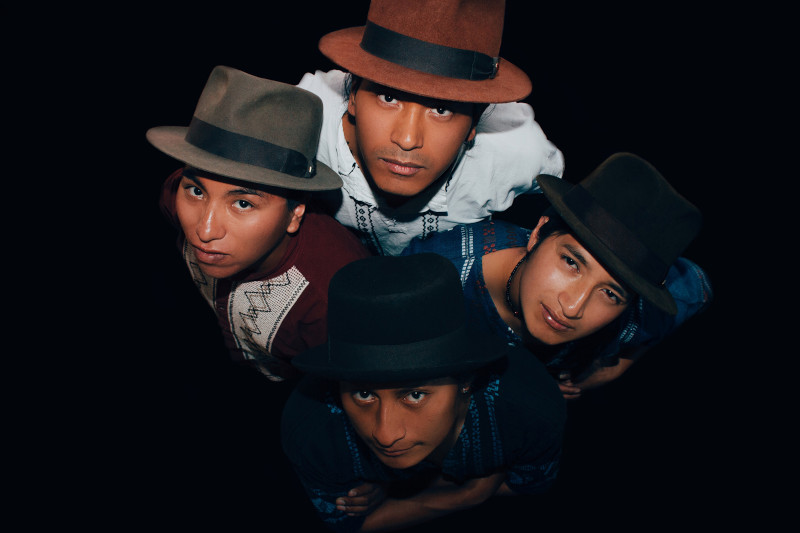 The band Runa Rap look up for the camera.