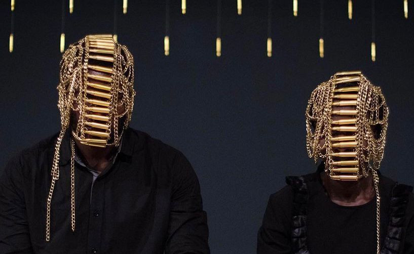 Two masked members of Sankofa.