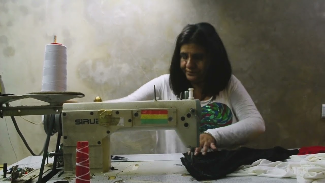 Woman sat at a sewing machine