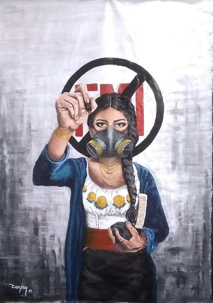 A woman wears a gas mask and holds a rock in one hand and the other aloft, with a prohibited sign in the background. 