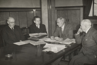 Black and white photograph of a meeting of the Scott Trust directors and Trustees.